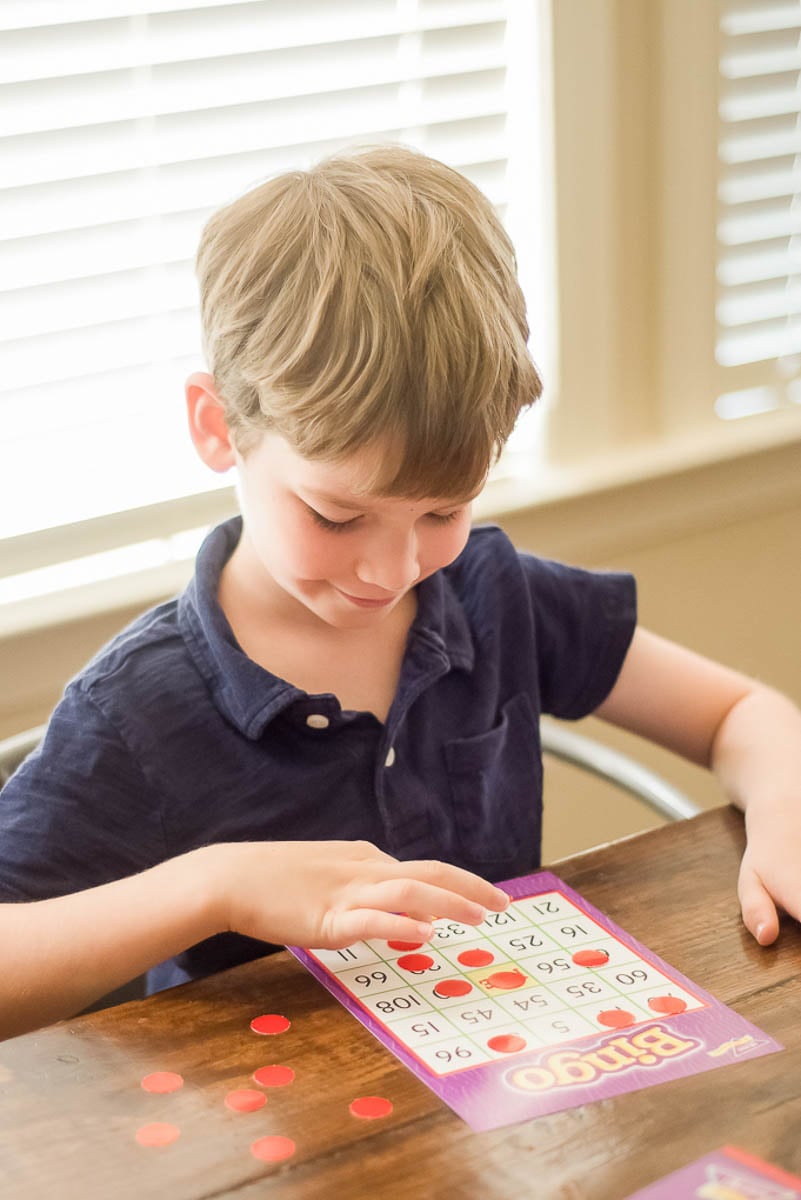 Young Boy Playing Math Bingo Game