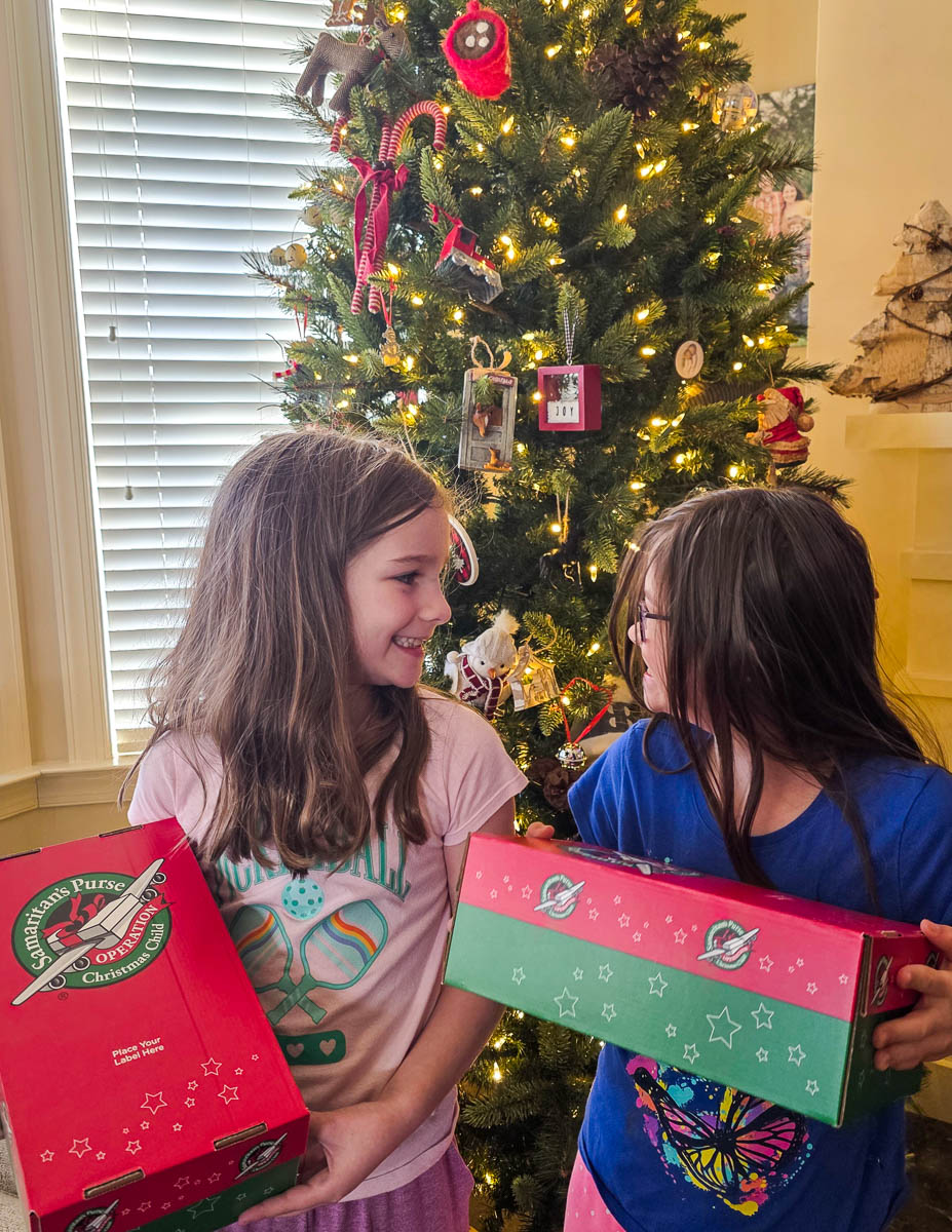 Girls in Front of Christmas Tree