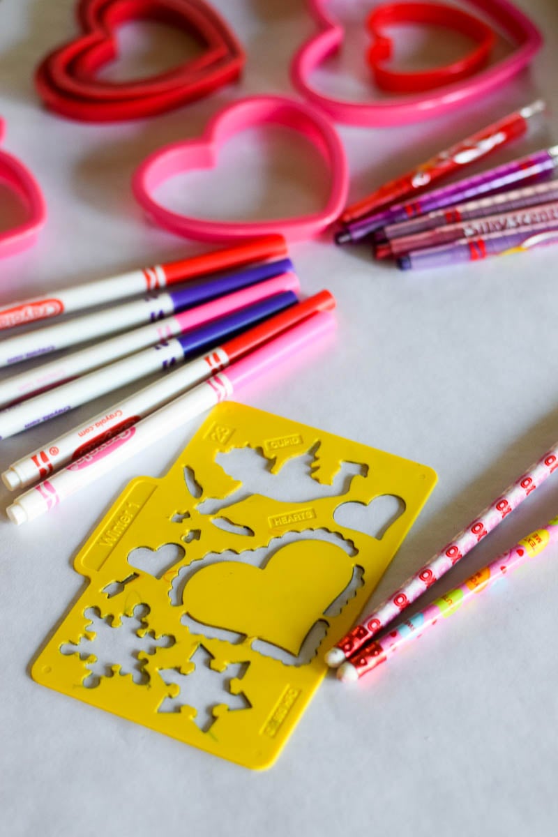Heart Cookie Cutters and Art Supplies on White Paper