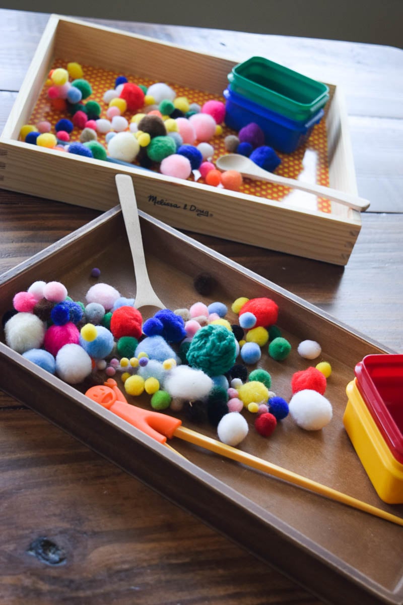Wooden Trays Filled with Colorful Poms