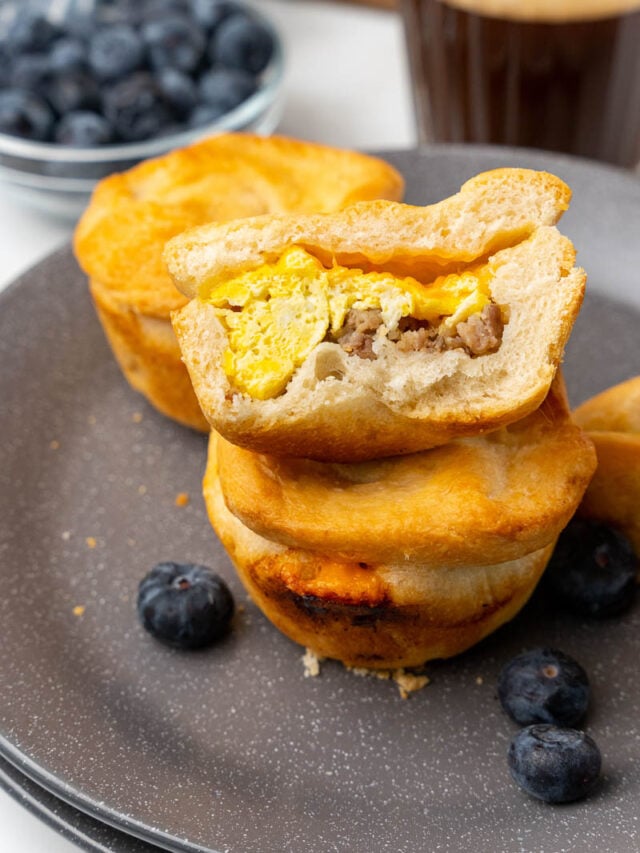 Stuffed Breakfast Calzones in Muffin Tin Pan - Made and Ready to Serve with a Side of Blueberries