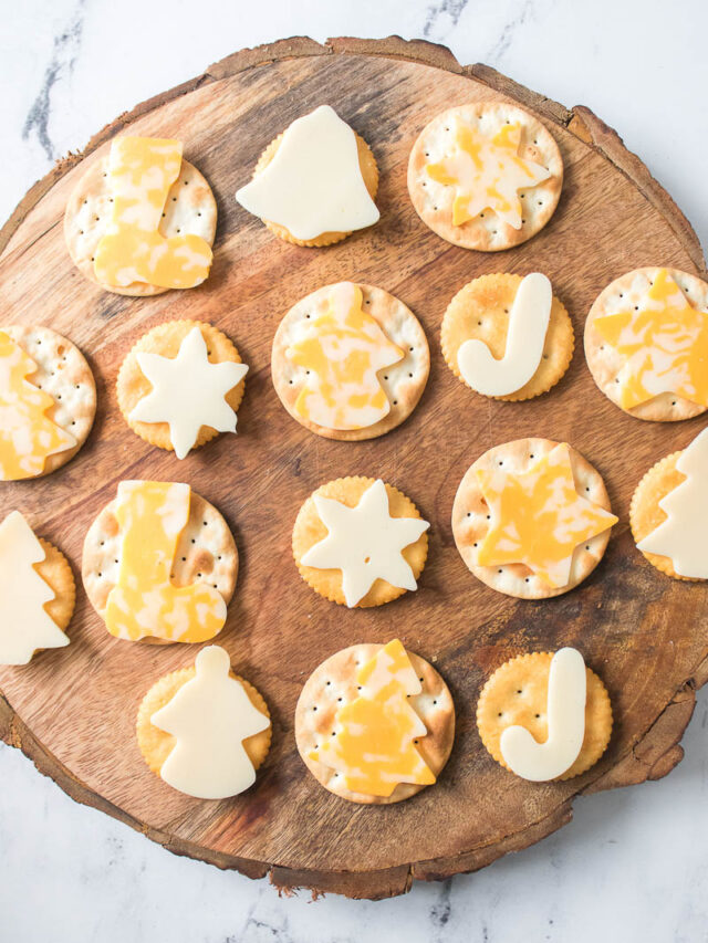 Cheese and Crackers on a Wooden Cutting Board