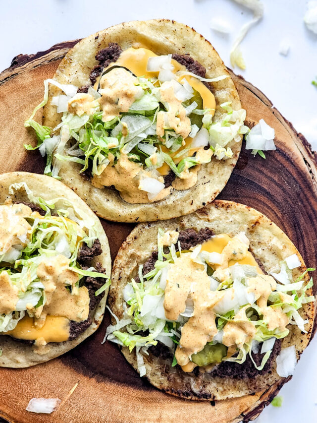 Cheeseburger Tacos Displayed on White Wooden Serving Board