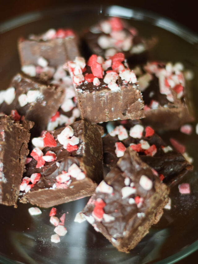 Squares of Fudge Stacked on a Clear Glass Serving Stand
