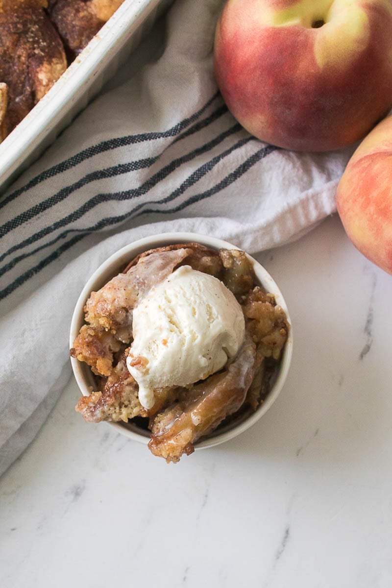 Peach Cobbler Served in Round Baking Dish