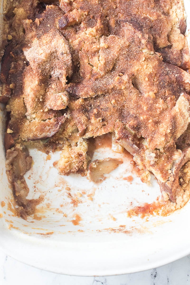 Peach Cobbler Leftovers in a Glass Baking Dish