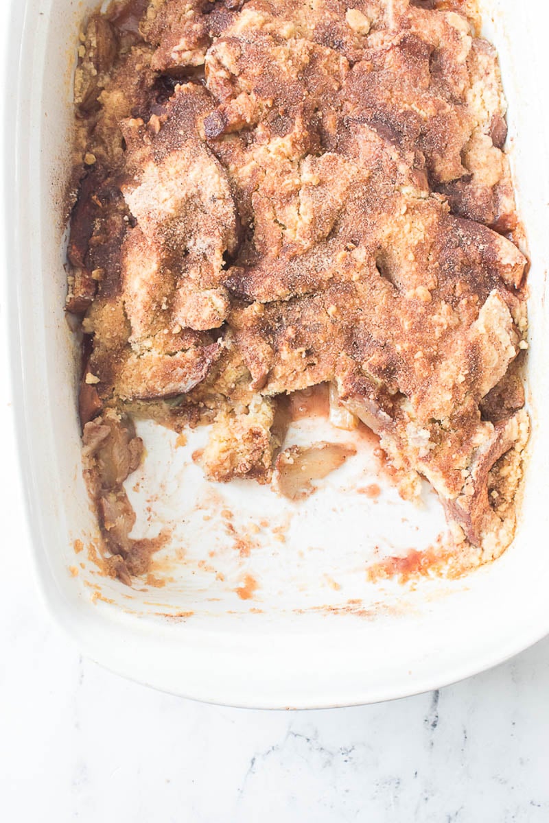 Peach Cobbler Leftovers in a Glass Baking Dish