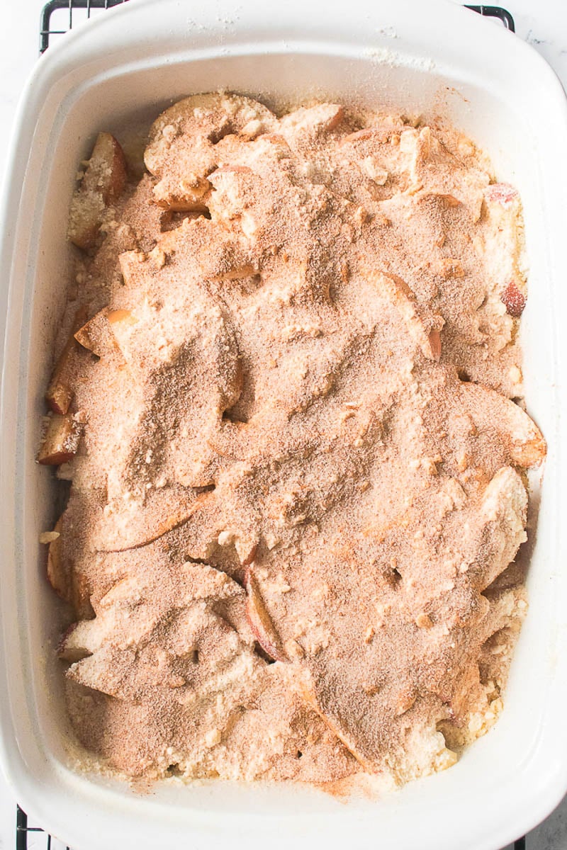 Topping Added to Apples in Glass Baking Dish