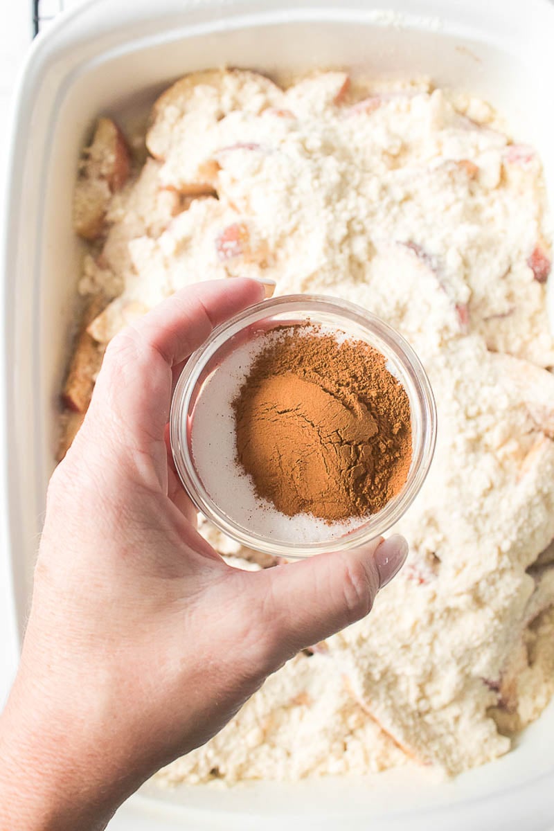 Topping Added to Apples in Glass Baking Dish