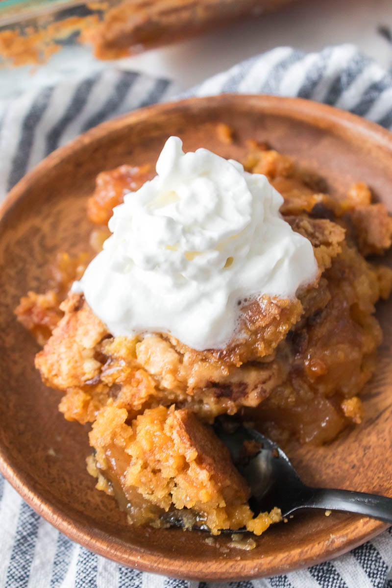 Apple Dump Cake on Serving Platter - With Whipped Topping on Top