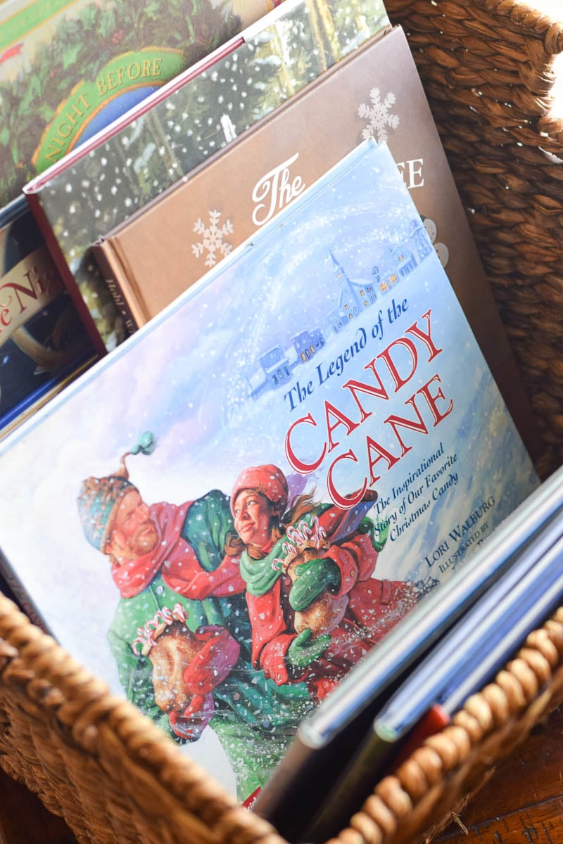 Christmas Books Organized in Brown Woven Basket