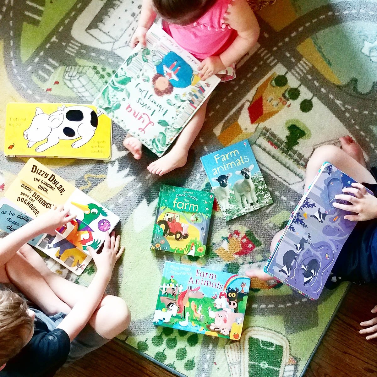 Children Reading Together on the Floor