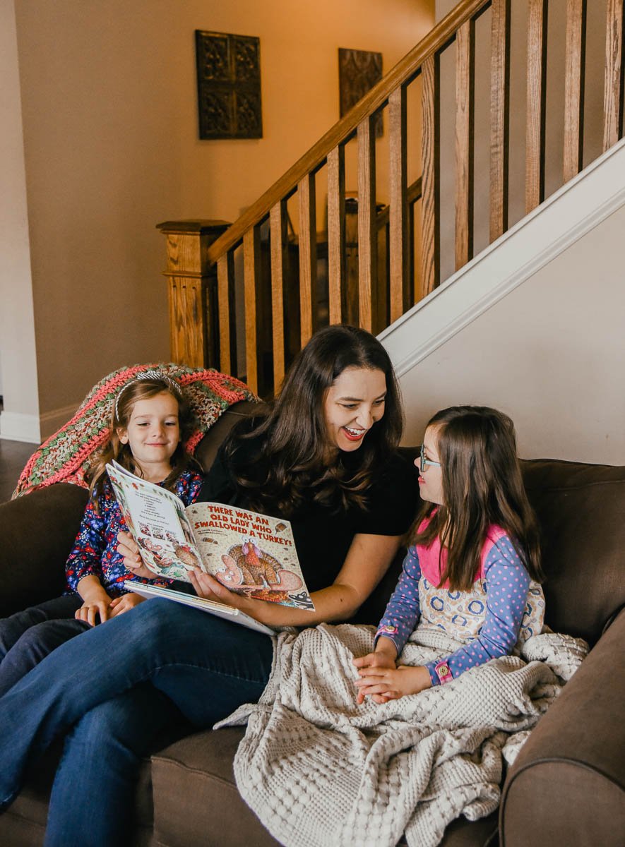 Mom and Kids Reading Together on the Couch