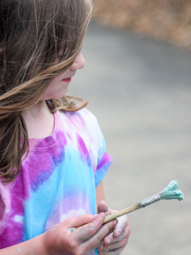 Young Girl Painting with Chalk
