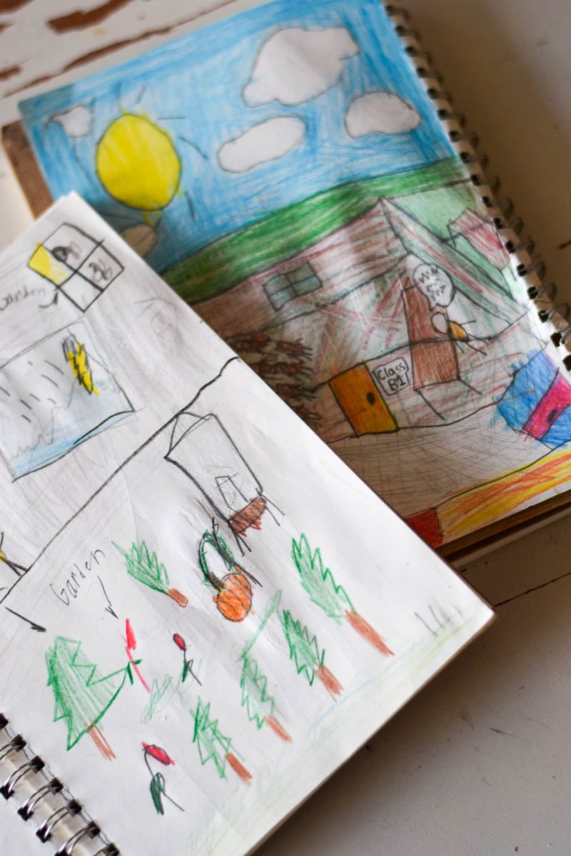 Small Journals Open with Kids Drawing Inside