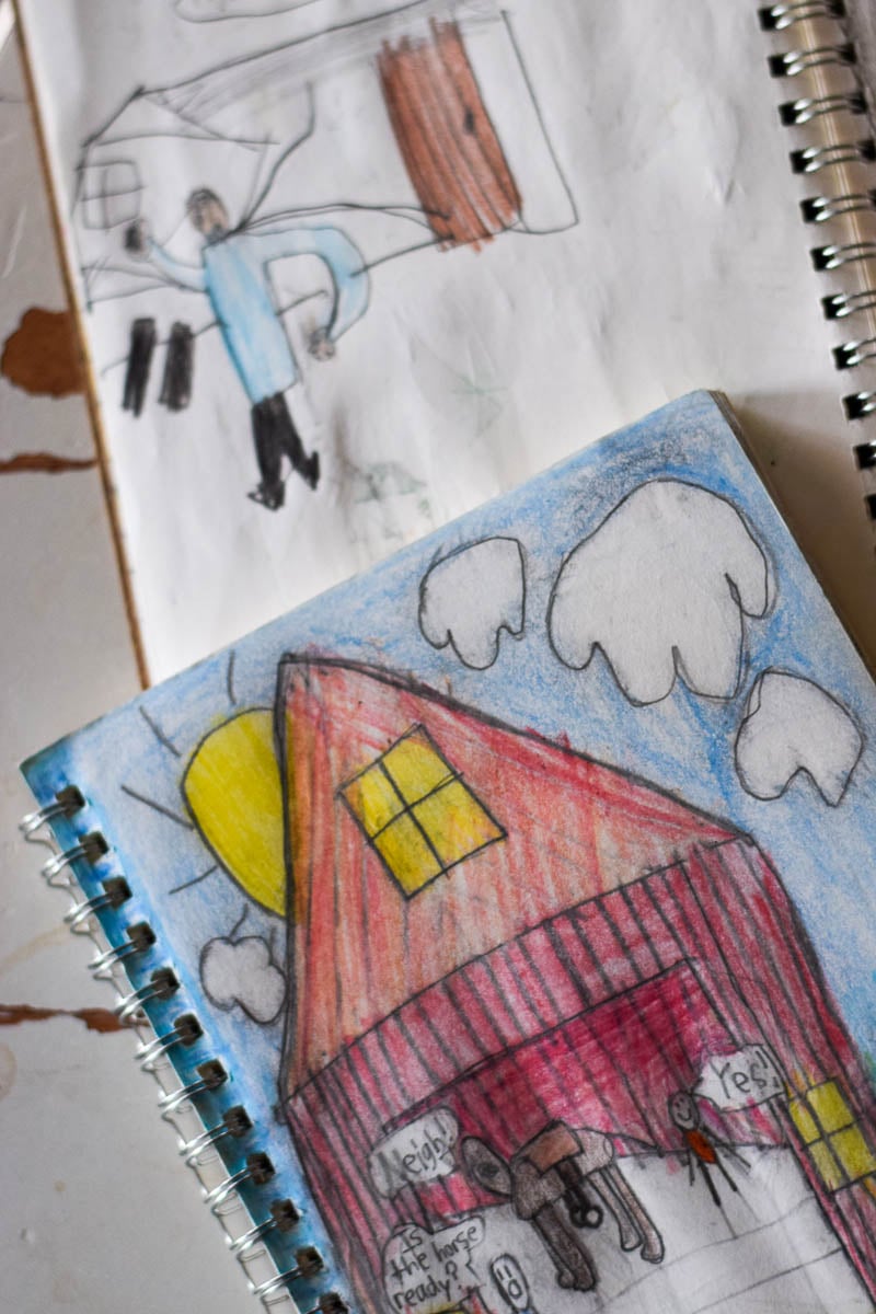 Small Journals Open with Kids Drawing Inside