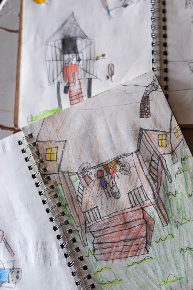 Small Journals Open with Kids Drawing Inside