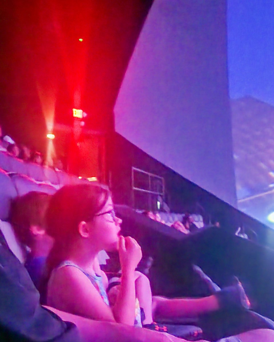 Child watching an Imax Movie