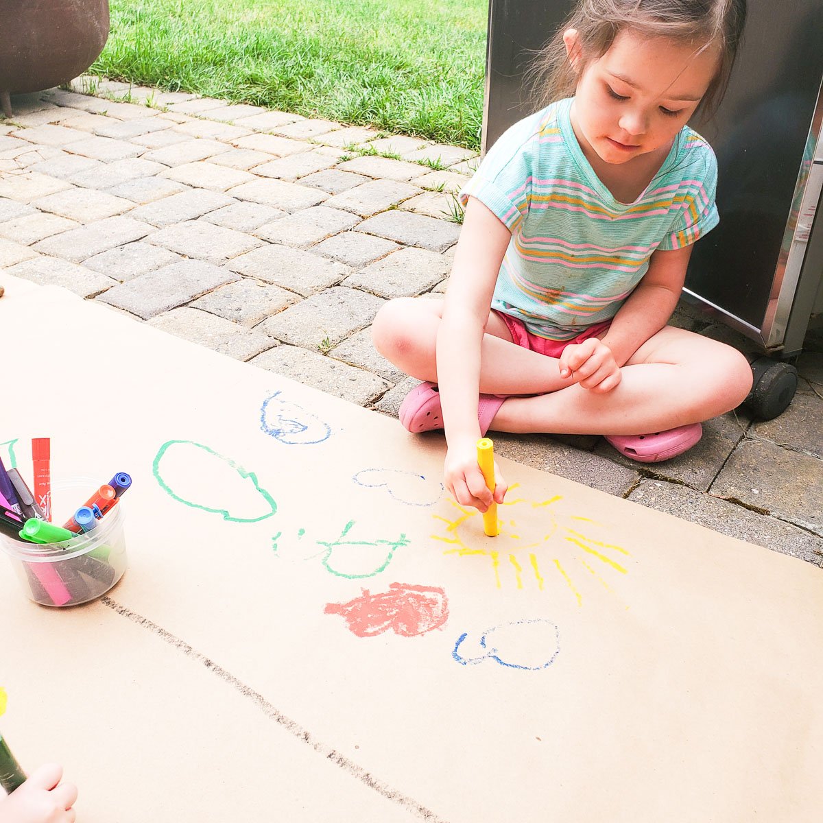 Kids Using Kwik Stix Paint Stix to Decorate Kraft Paper