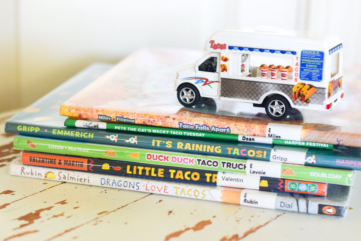 Toy Truck Sitting on Top of Stack of Kids Books