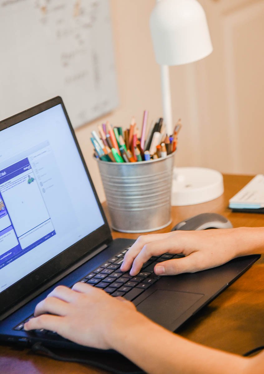 Hands Typing on a Chromebook
