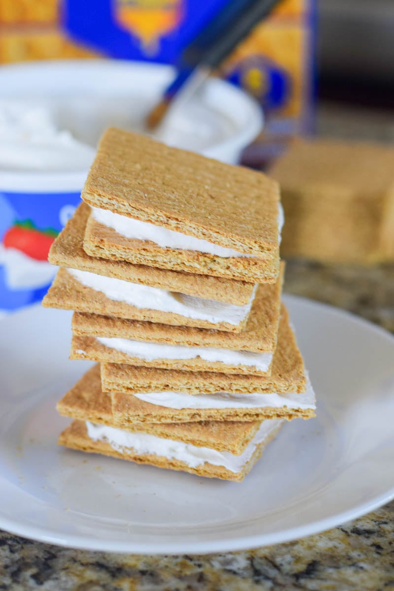 Cool Whip Graham Cracker Sandwiches Sitting on White Plate