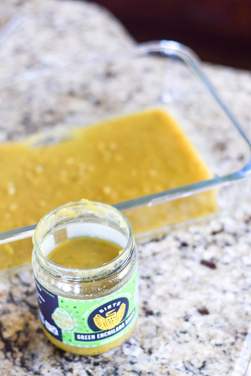 Green Enchilada Sauce Poured in Glass Baking Dish