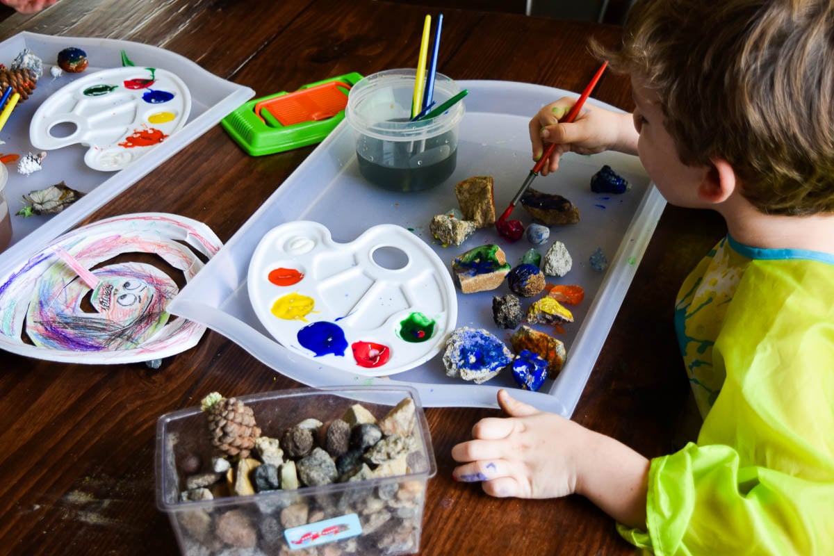 Preschool Child Painting Rocks