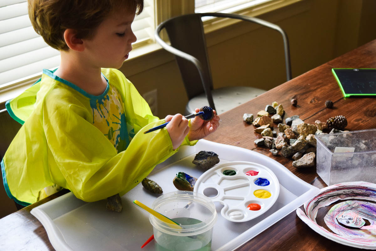 Preschool Child Painting Rocks