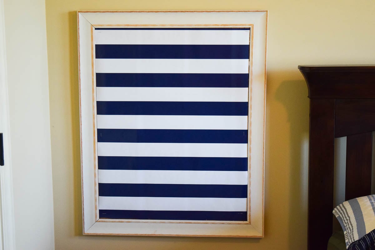 A Bulletin Board with Wrapping Paper Stapled to It