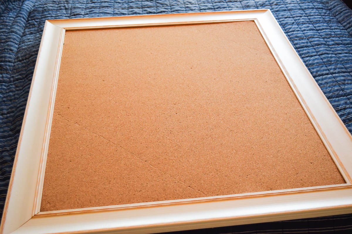 A Cork Board with a Frame Around It
