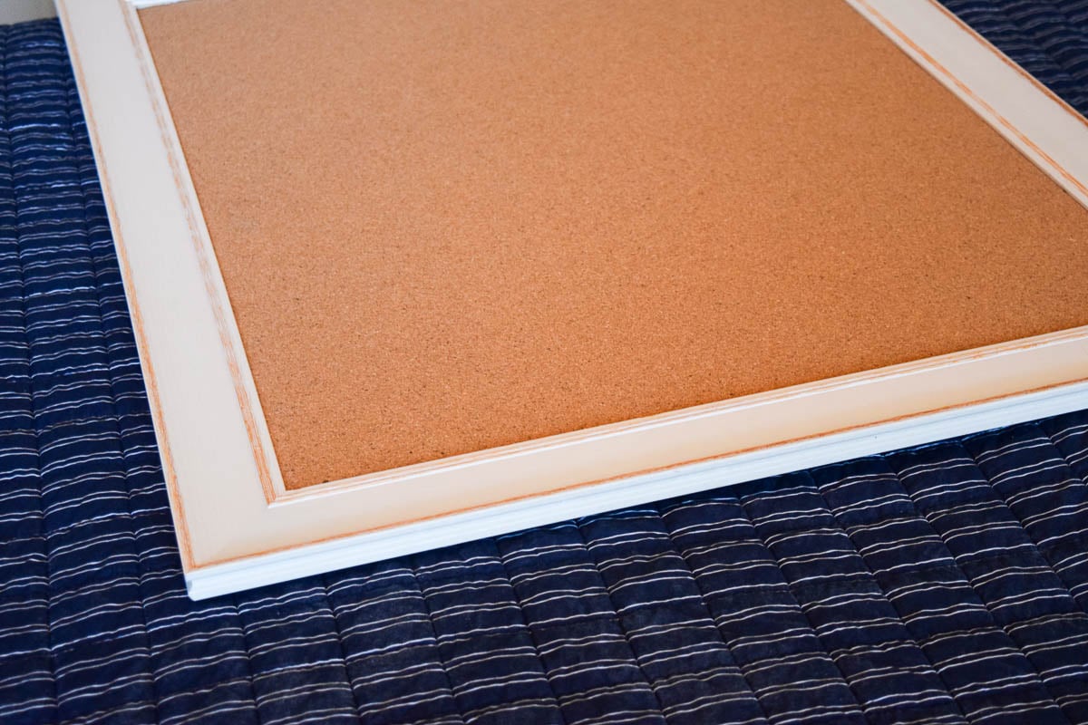 A Cork Board with a Frame Around It