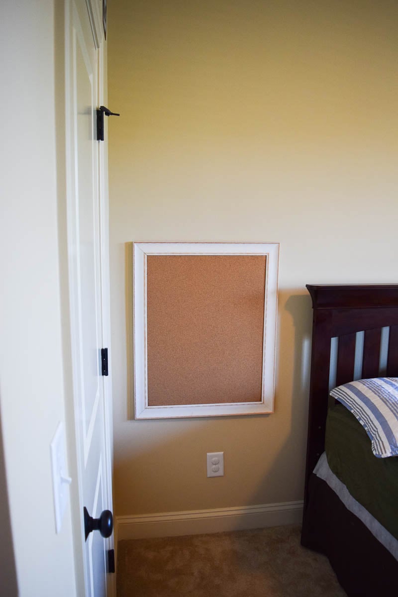 A Cork Board Hanging on a Bedroom Wall