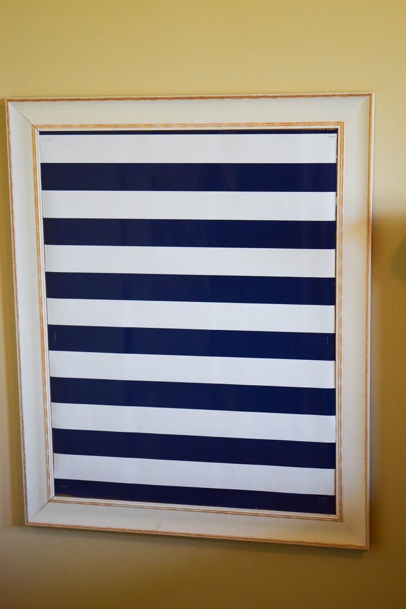 A Bulletin Board with Wrapping Paper Stapled to It