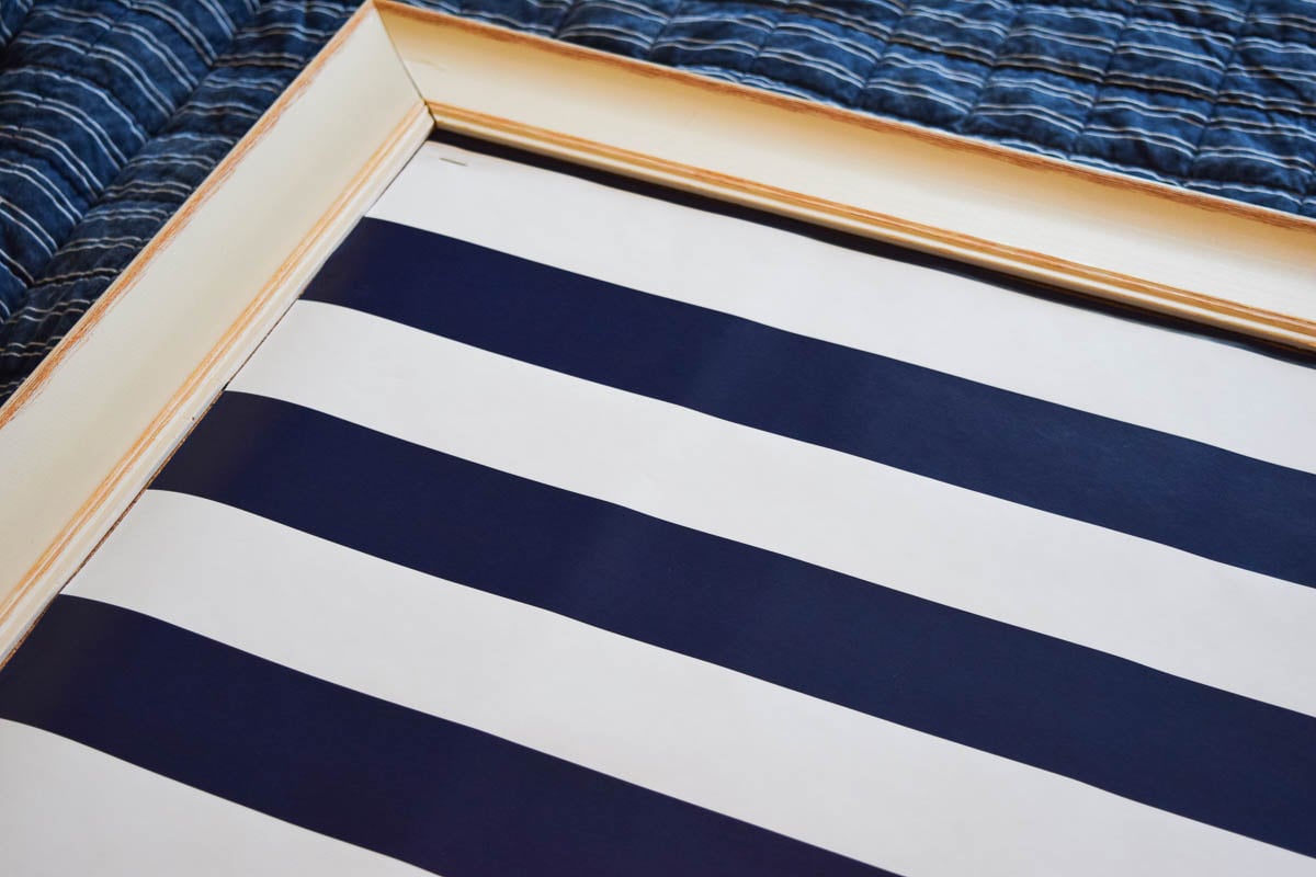 A Bulletin Board with Wrapping Paper Stapled to It