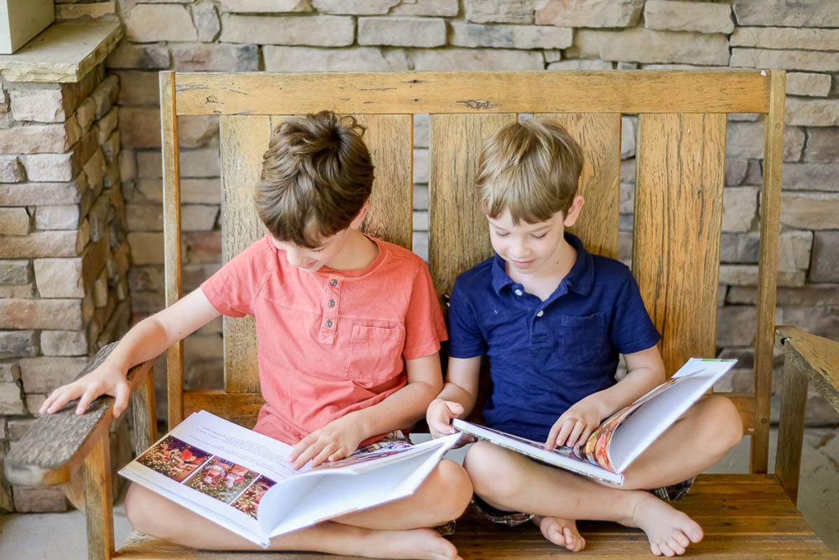 Two Boys Looking at Photo Albums