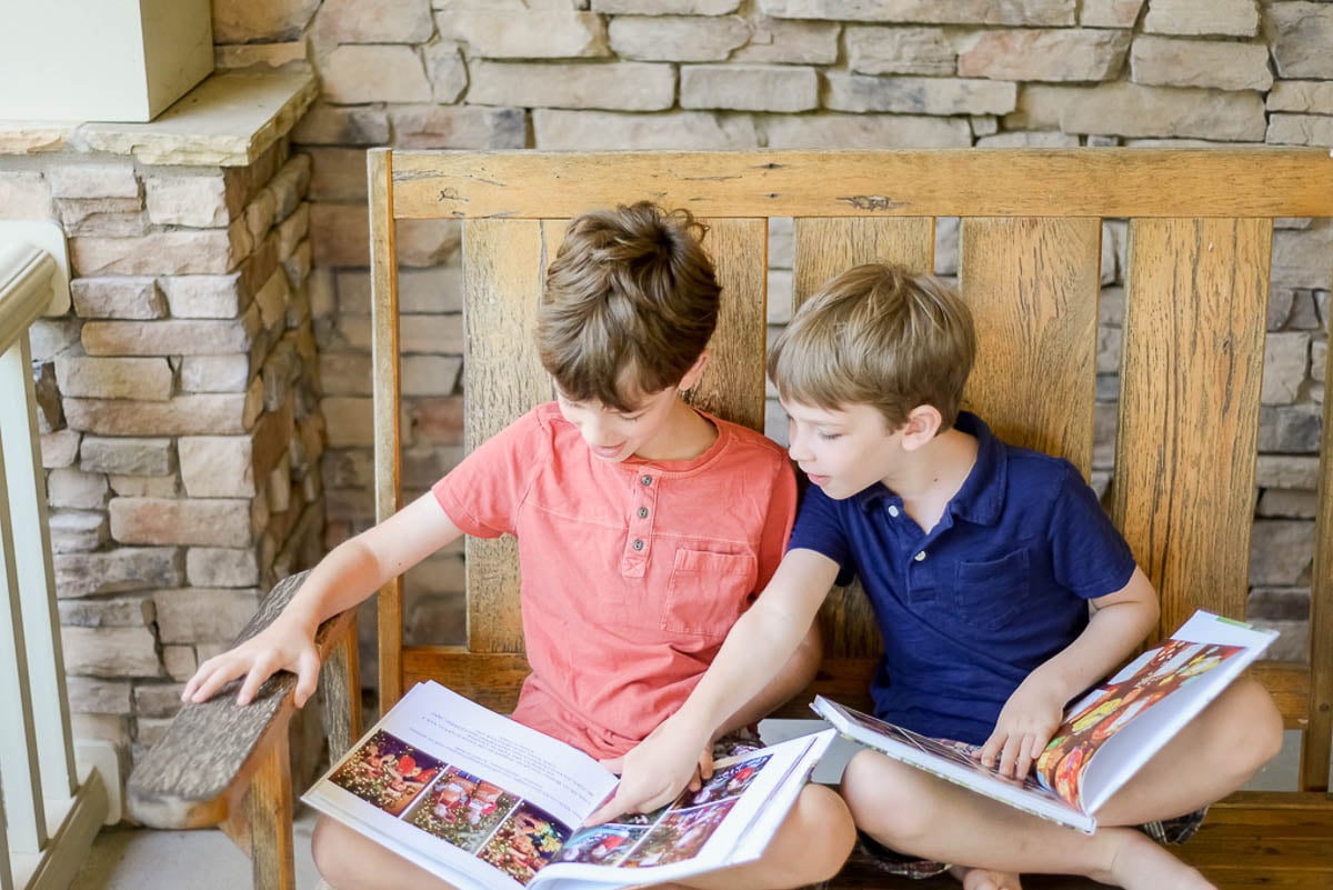 Two Boys Looking at Photo Albums