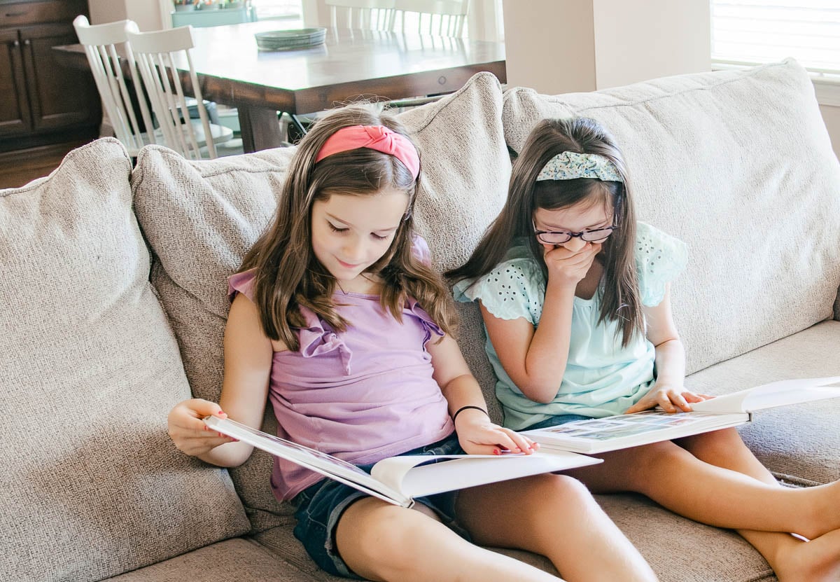 Two Girls Looking at Photo Albums