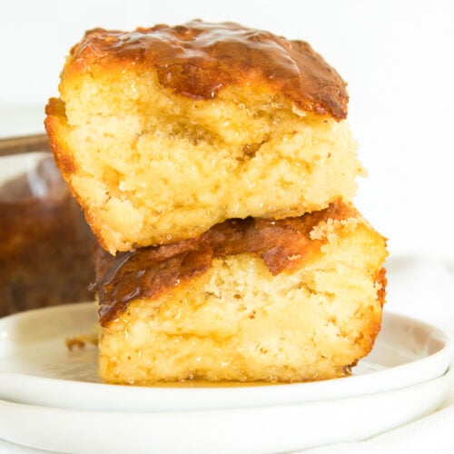 Two Biscuits Sitting on a White Plate