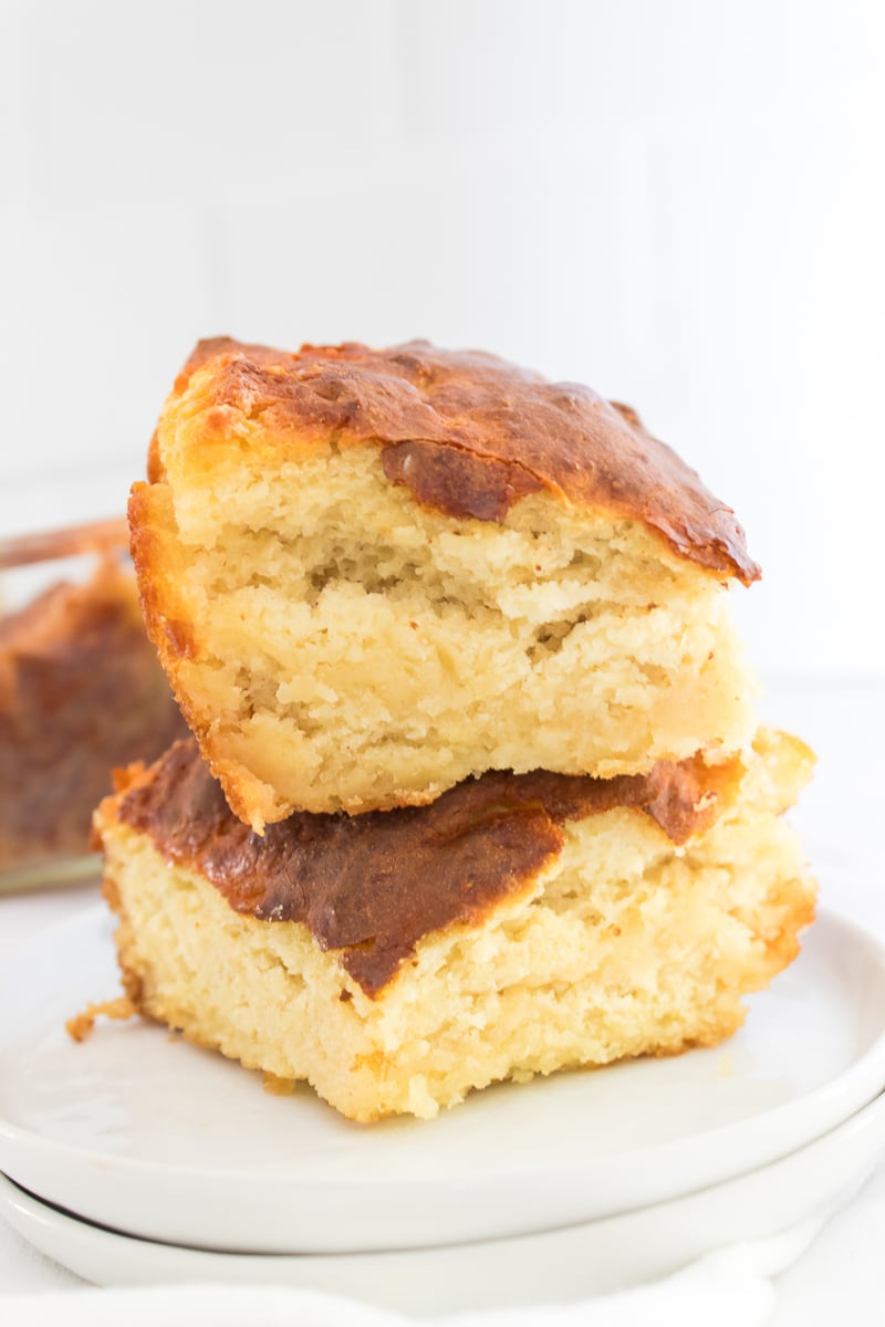 Two Biscuits Sitting on a White Plate