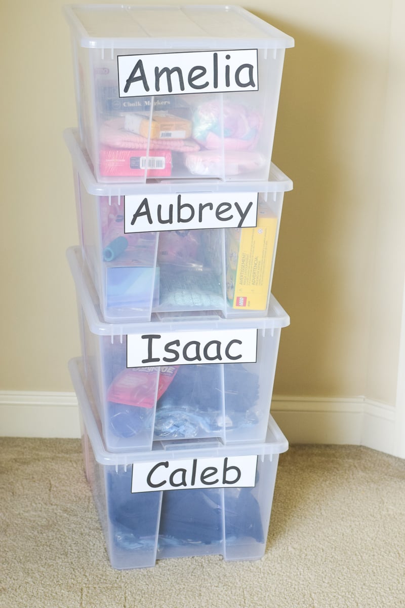 A Stack of Four Plastic Totes Used as Gift Bins