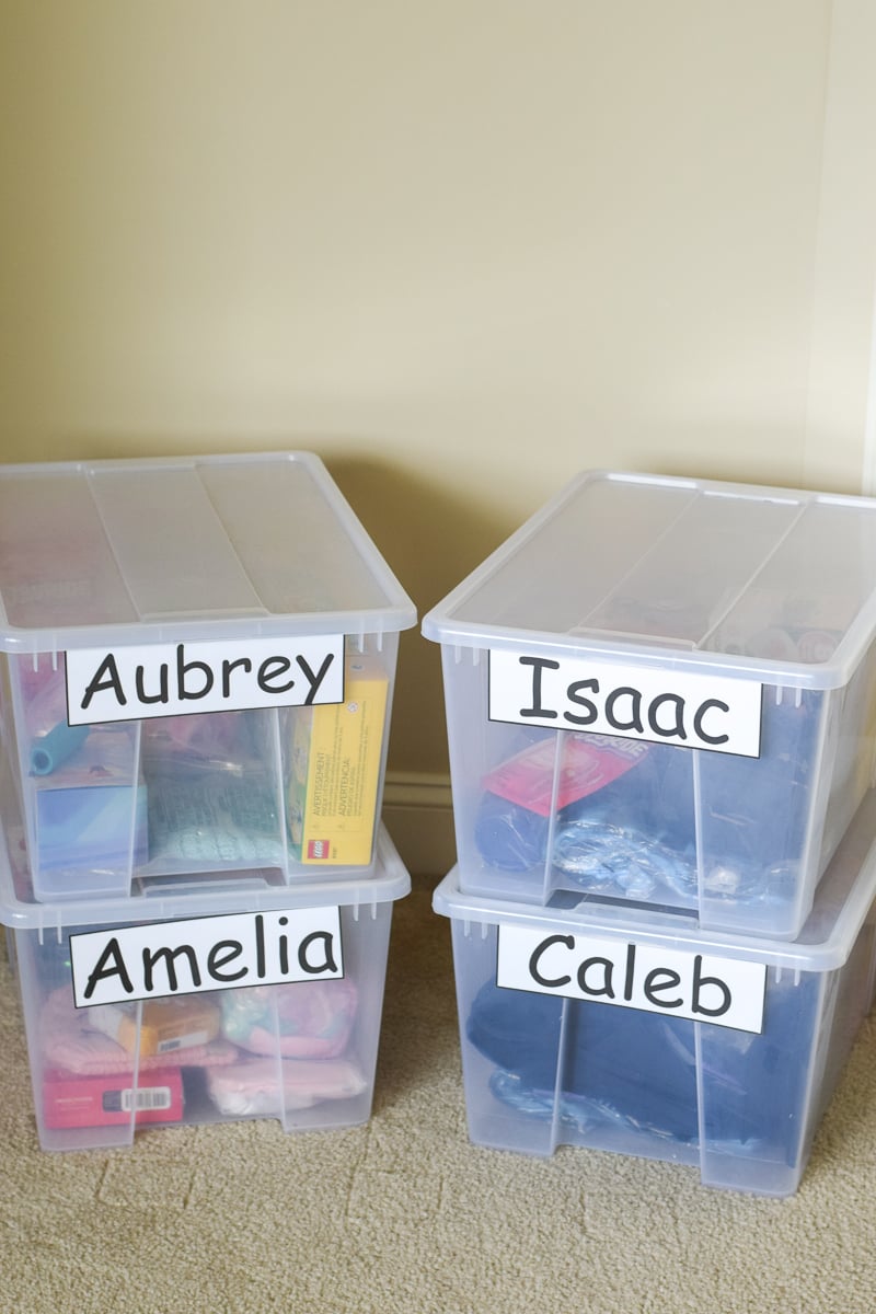 Four Plastic Bins Full of Gifts for Kids