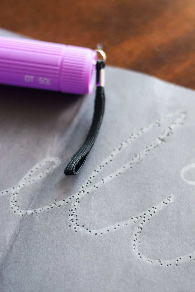 Girls Name Writing/Hole Punched Onto a Piece of Construction Paper